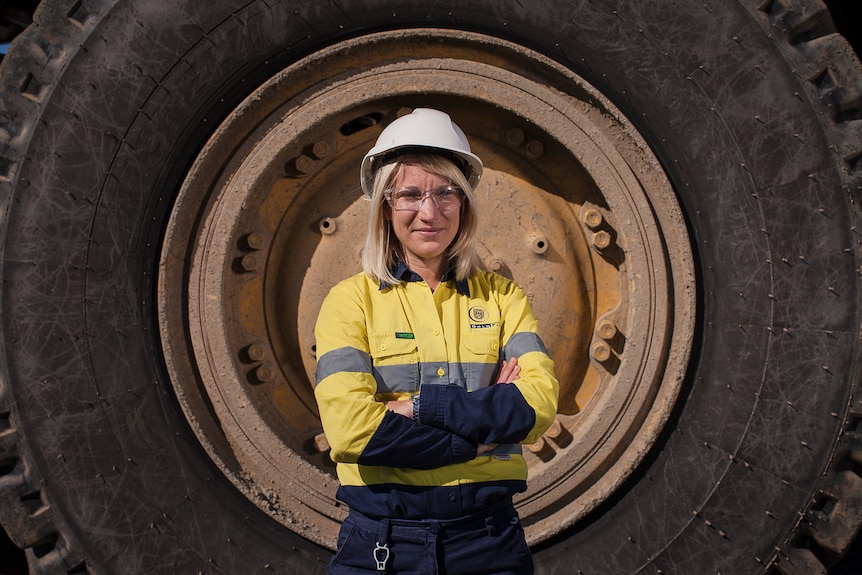 Kelly Carter stands in front of a giant tyre